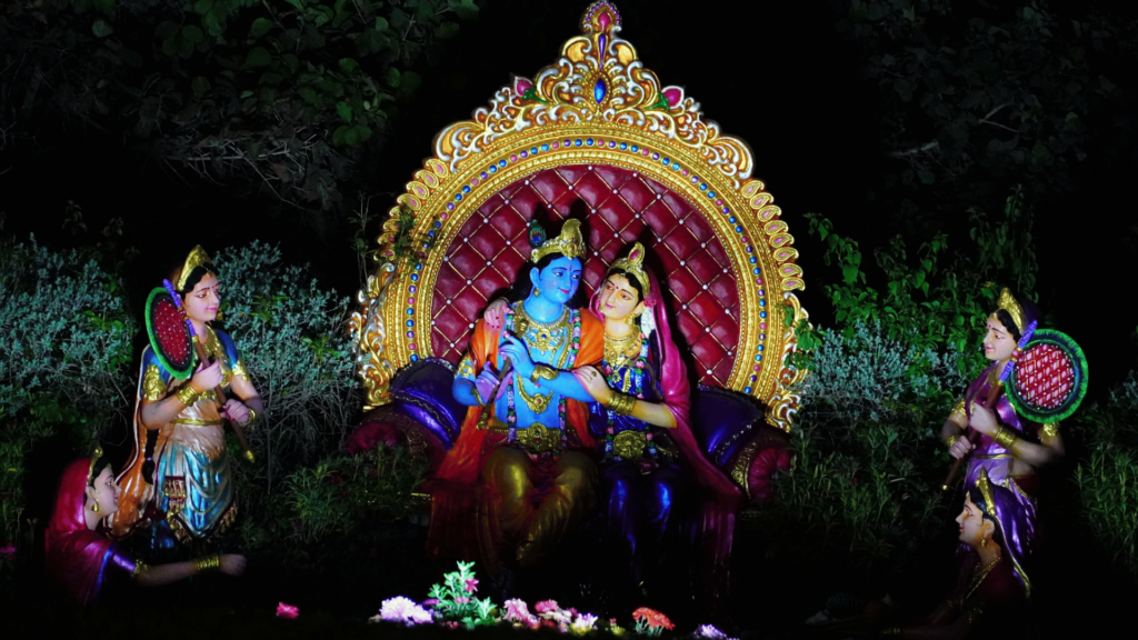 Krishna e Radha sentados na imagem da estátua do trono. 
